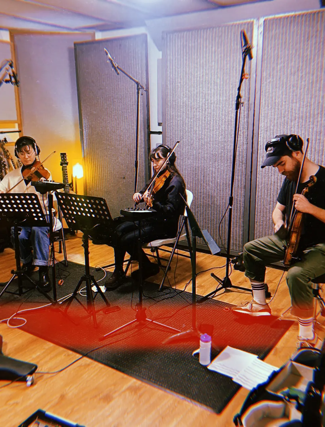 String players tracking in a live room at Press Play Studio